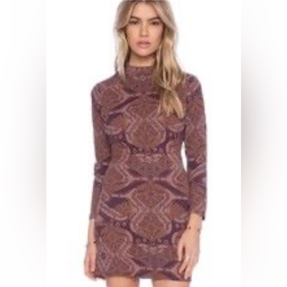Free People Movement XS Body Shaping mini dress w/cut out back.